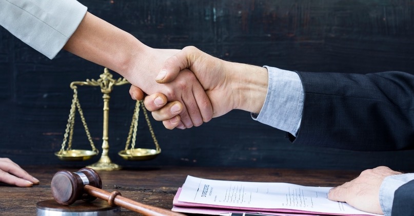 Lawyer and Client Handshake
